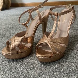 Women’s rose gold snake skin print heels